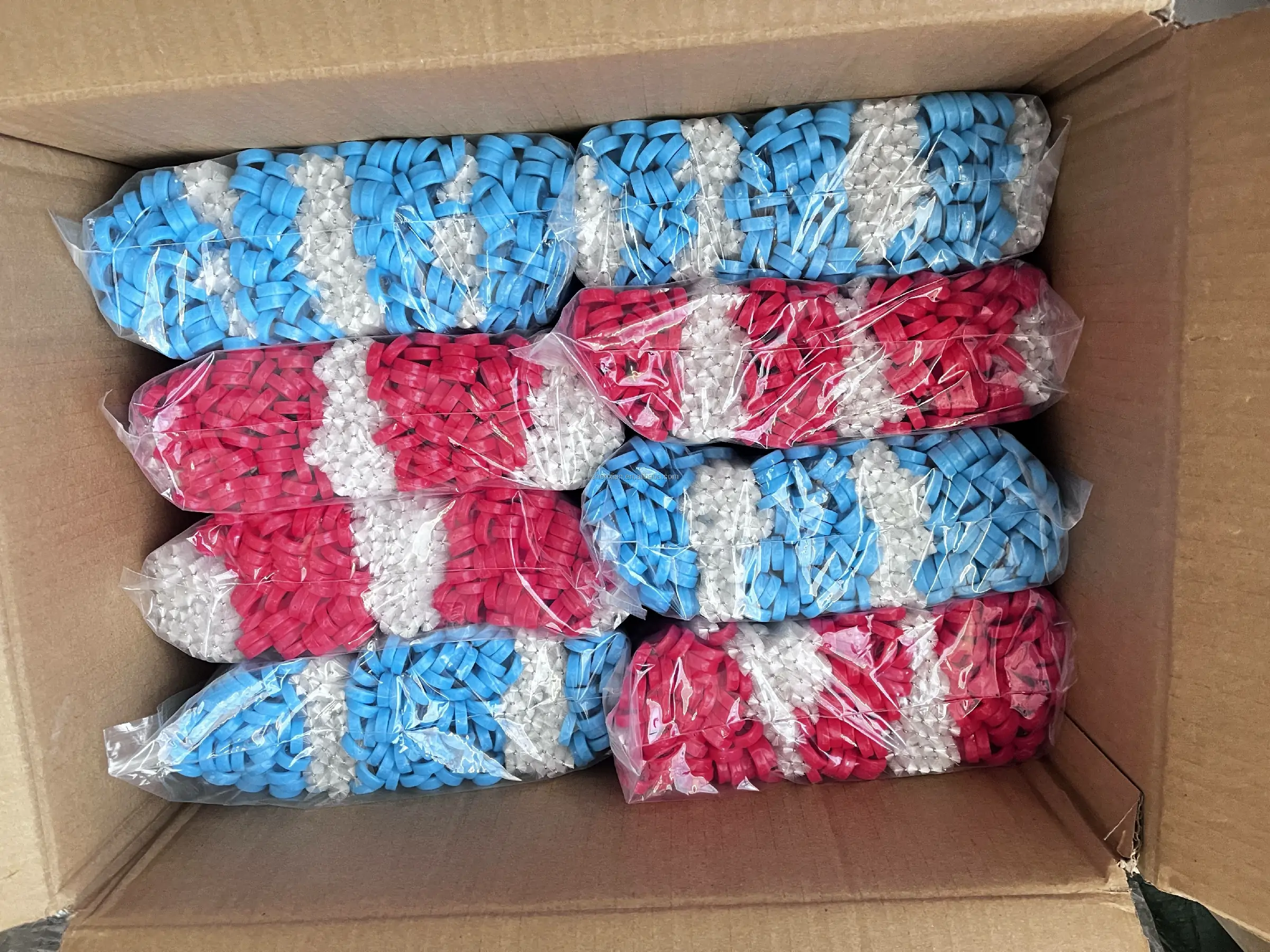 Small brush products packed in sealed inner bags and arranged inside a shipping carton for delivery.