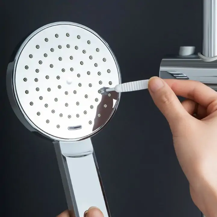 Twisted-wire faucet aerator brush for clearing mineral scale from flow screens and diffuser discs