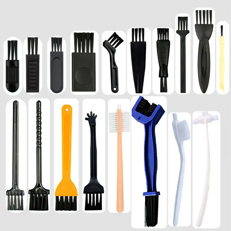 Retractable keyboard brush with soft filament for lifting dust and crumbs from between keycaps