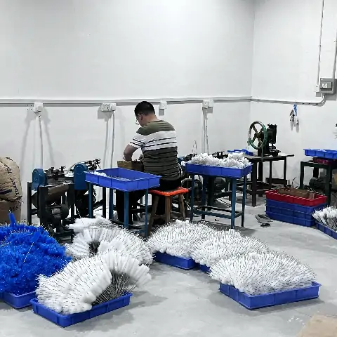 Brush production worker and finished brushes